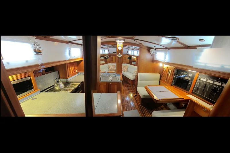 Dreamwalker Yacht Photos Pics Luxurious interior of 2008 Gozzard 41B yacht with wood finishes and modern amenities.