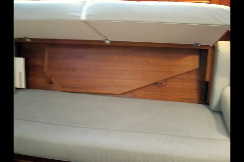 Dreamwalker Yacht Photos Pics Interior view of a 2008 Gozzard 41B sailboat, showcasing under-seat storage.