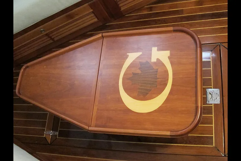 Dreamwalker Yacht Photos Pics Wooden table with inlay design on a 2008 Gozzard 41B yacht interior.