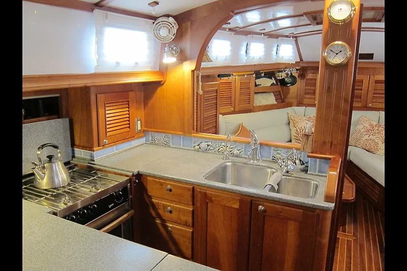 Dreamwalker Yacht Photos Pics Luxurious 2008 Gozzard 41B yacht interior with elegant wood finish and modern kitchen amenities.