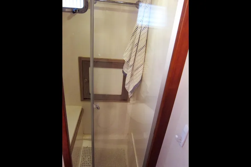 Dreamwalker Yacht Photos Pics Shower area in 2008 Gozzard 41B yacht with glass door and towel.