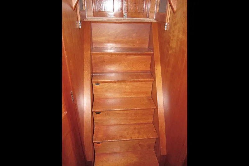 Dreamwalker Yacht Photos Pics Wooden interior stairs on a 2008 Gozzard 41B yacht.