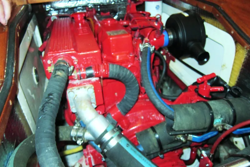 Dreamwalker Yacht Photos Pics Engine compartment of a 2008 Gozzard 41B sailboat, featuring red engine components.