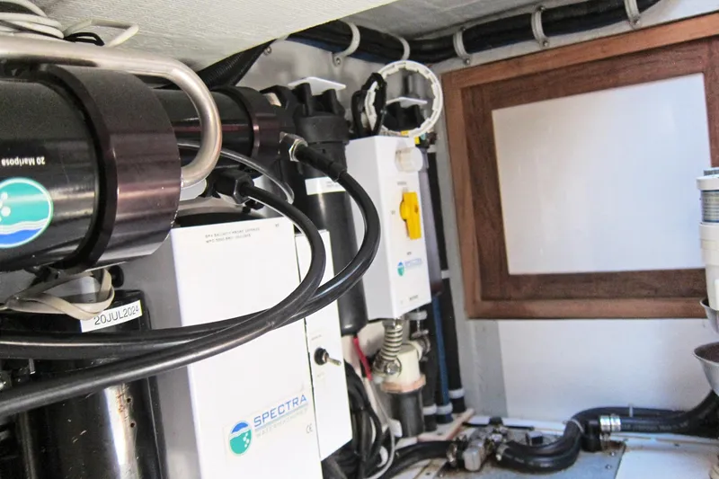 Dreamwalker Yacht Photos Pics Engine room of 2008 Gozzard 41B yacht with Spectra watermaker system.