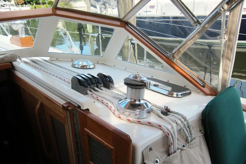 Dreamwalker Yacht Photos Pics 2008 Gozzard 41B sailboat cockpit with winch, ropes, and wooden trim.