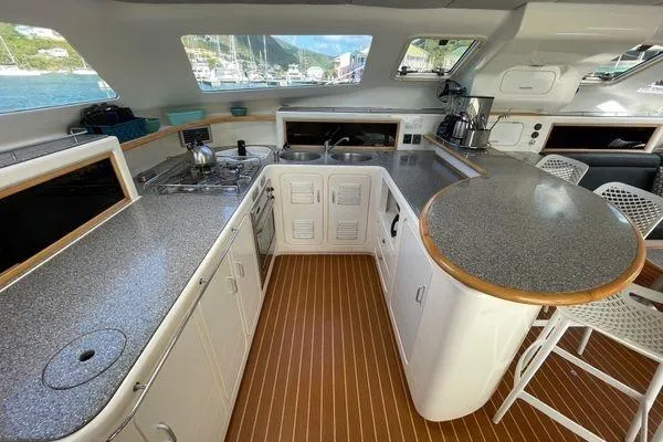 Knot Bad! Yacht Photos Pics Spacious kitchen in 2008 Voyage Yachts 500 with modern appliances and sleek countertops.