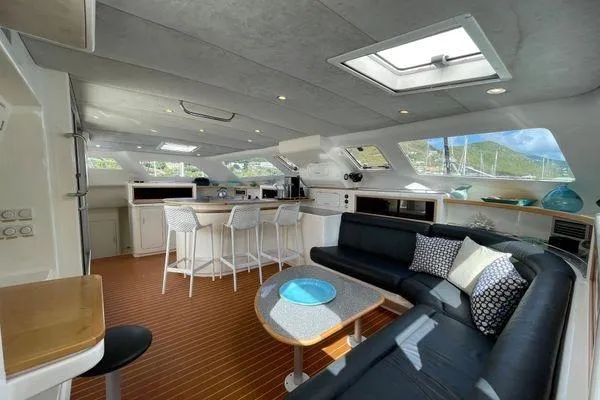 Knot Bad! Yacht Photos Pics Luxurious interior of 2008 Voyage Yachts 500 with modern seating and dining area.