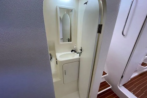 Knot Bad! Yacht Photos Pics Compact bathroom in a 2008 Voyage Yachts 500, featuring a sink and mirror.