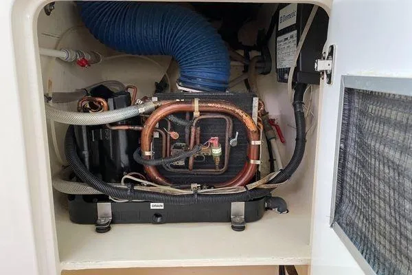 Knot Bad! Yacht Photos Pics Engine compartment of 2008 Voyage Yachts 500, showcasing mechanical components and wiring.