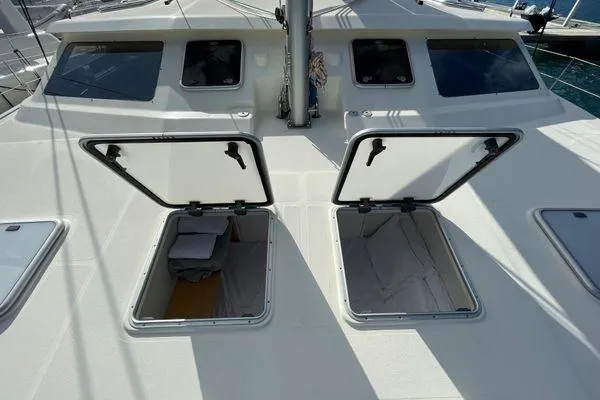 Knot Bad! Yacht Photos Pics Deck view of 2008 Voyage Yachts 500 with open storage hatches.
