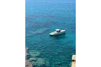 2023 Solaris Power 40 Open yacht on clear blue sea.