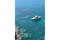 2023 Solaris Power 40 Open yacht on clear blue ocean waters.