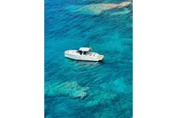 2023 Solaris Power 40 Open yacht on clear turquoise water.