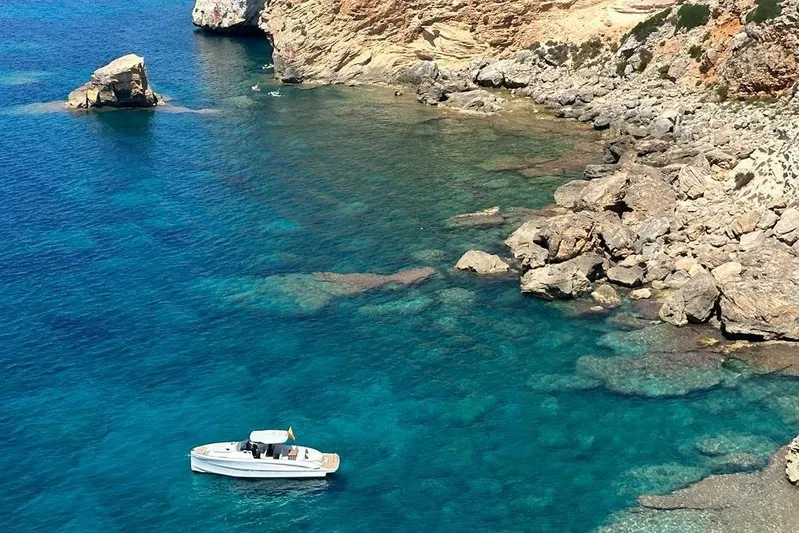 Esimar Yacht Photos Pics 2023 Solaris Power 40 Open yacht in clear blue coastal waters.