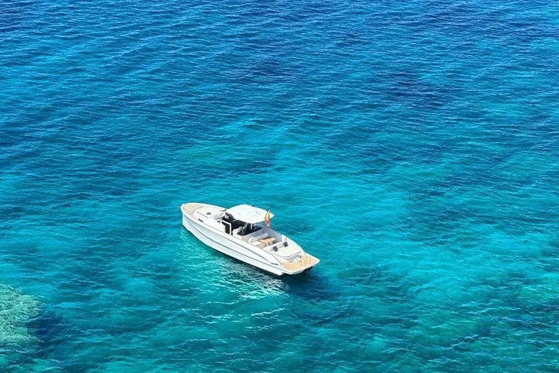 Esimar Yacht Photos Pics 2023 Solaris Power 40 Open yacht on vibrant blue ocean waters.