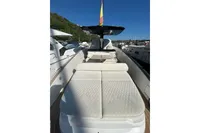 2023 Solaris Power 40 Open yacht with luxurious deck seating in a marina.