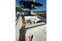 2023 Solaris Power 40 Open yacht with elegant seating and sleek design in a marina setting.