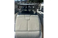 2023 Solaris Power 40 Open yacht with quilted sunbed, docked in a marina.