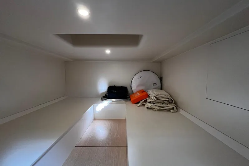 Esimar Yacht Photos Pics Interior cabin of 2023 Solaris Power 40 Open yacht, featuring storage space and minimalistic design.