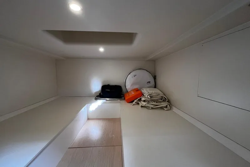 Esimar Yacht Photos Pics Interior cabin of 2023 Solaris Power 40 Open yacht, featuring storage space and minimalistic design.