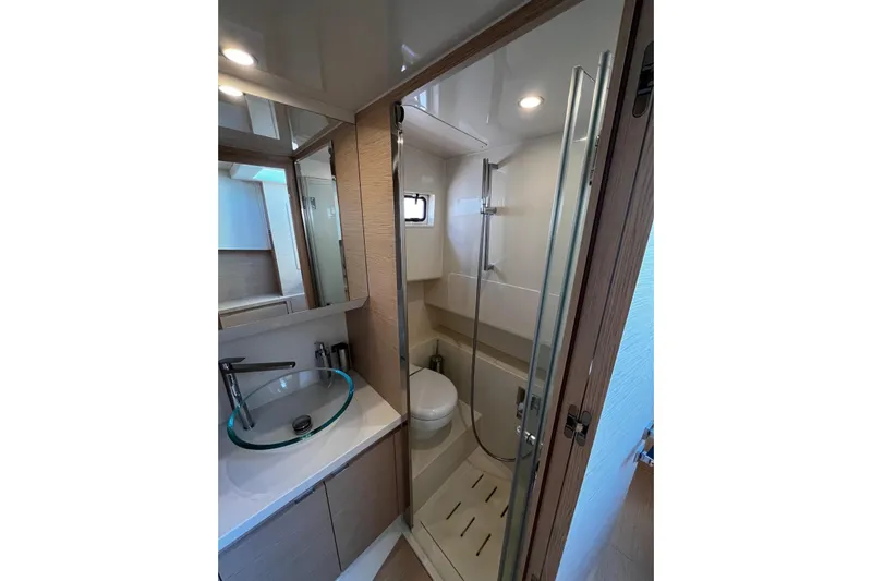 Esimar Yacht Photos Pics Modern bathroom interior of 2023 Solaris Power 40 Open yacht, featuring sleek design and fixtures.