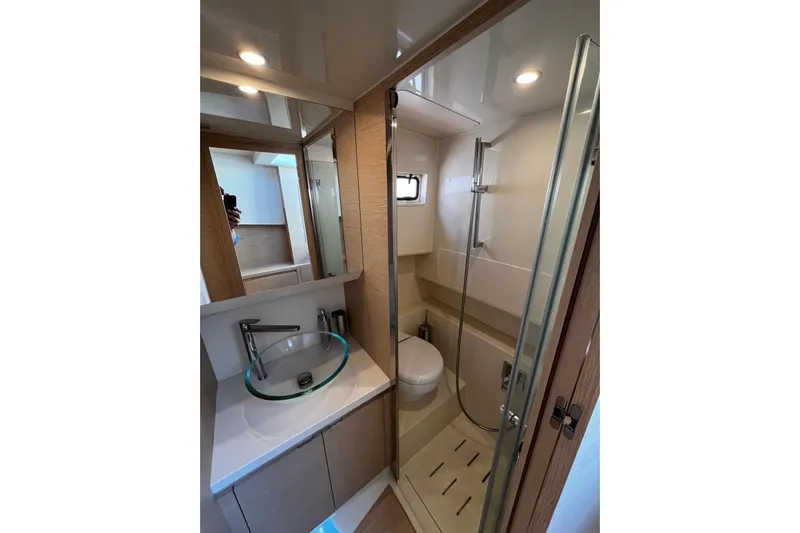 Esimar Yacht Photos Pics Luxurious bathroom in 2023 Solaris Power 40 Open yacht, featuring modern fixtures and elegant design.
