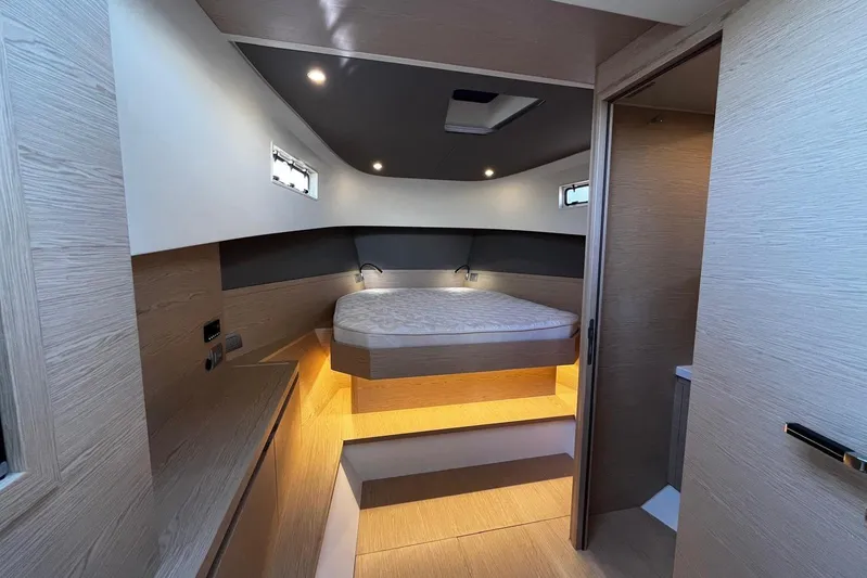 Esimar Yacht Photos Pics Luxurious cabin interior of 2023 Solaris Power 40 Open yacht, featuring modern design and ambient lighting.