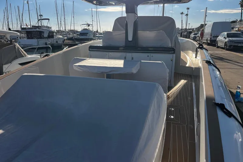 Esimar Yacht Photos Pics 2023 Solaris Power 40 Open yacht interior at marina, showcasing sleek design and seating area.