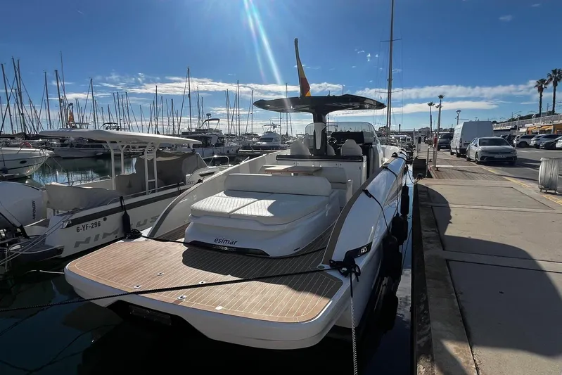 Esimar Yacht Photos Pics 2023 Solaris Power 40 Open yacht docked at marina under clear blue sky.