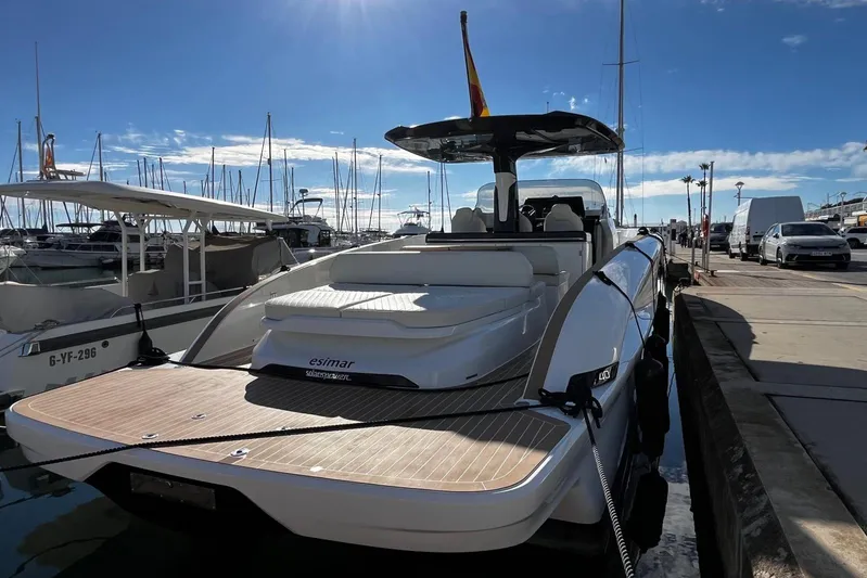 Esimar Yacht Photos Pics 2023 Solaris Power 40 Open yacht docked at marina under clear blue sky.