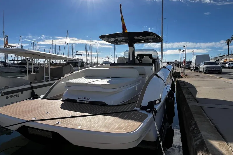 Esimar Yacht Photos Pics 2023 Solaris Power 40 Open yacht docked at marina under clear blue sky.