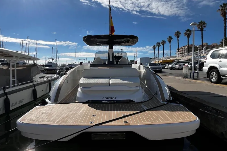 Esimar Yacht Photos Pics 2023 Solaris Power 40 Open yacht docked at marina under blue sky.