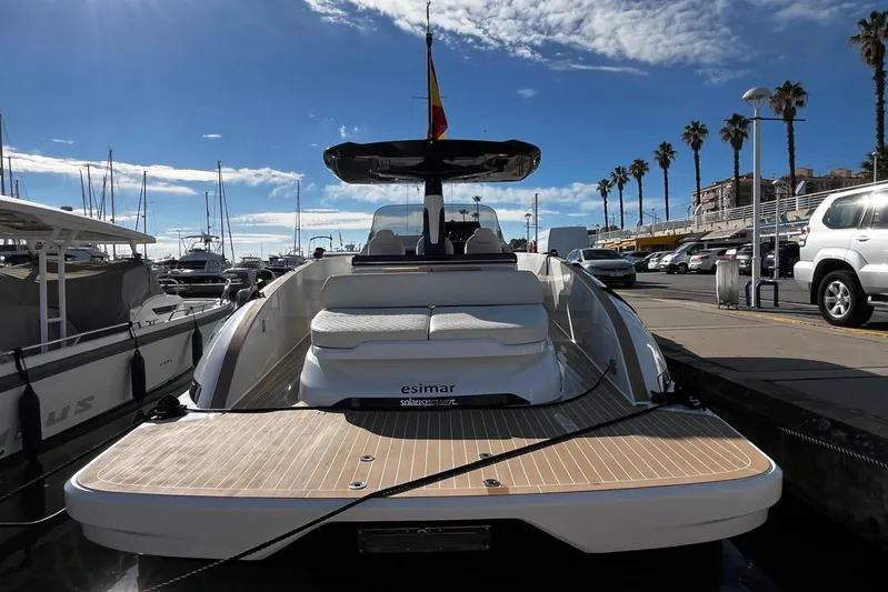 Esimar Yacht Photos Pics 2023 Solaris Power 40 Open yacht docked at a marina under a clear blue sky.