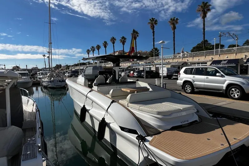 Esimar Yacht Photos Pics 2023 Solaris Power 40 Open yacht docked at a marina under a clear blue sky.