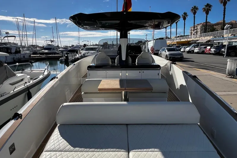 Esimar Yacht Photos Pics 2023 Solaris Power 40 Open yacht docked at marina with luxurious seating and sleek design.