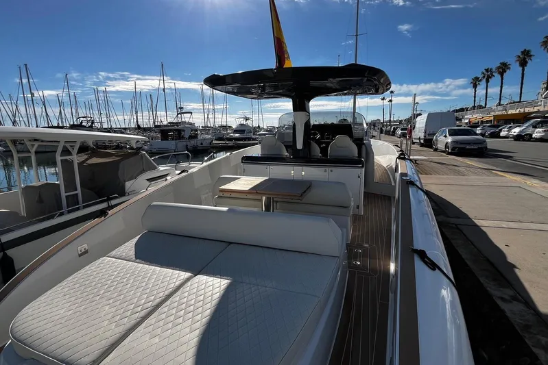 Esimar Yacht Photos Pics 2023 Solaris Power 40 Open yacht docked at marina under clear blue sky.
