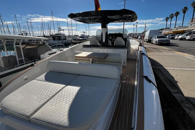 Esimar Yacht Photos Pics 2023 Solaris Power 40 Open yacht docked at marina, showcasing luxurious seating and sleek design.