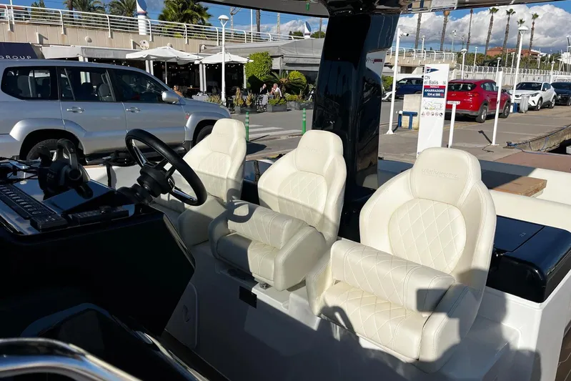 Esimar Yacht Photos Pics Luxurious interior of 2023 Solaris Power 40 Open yacht with white leather seats.