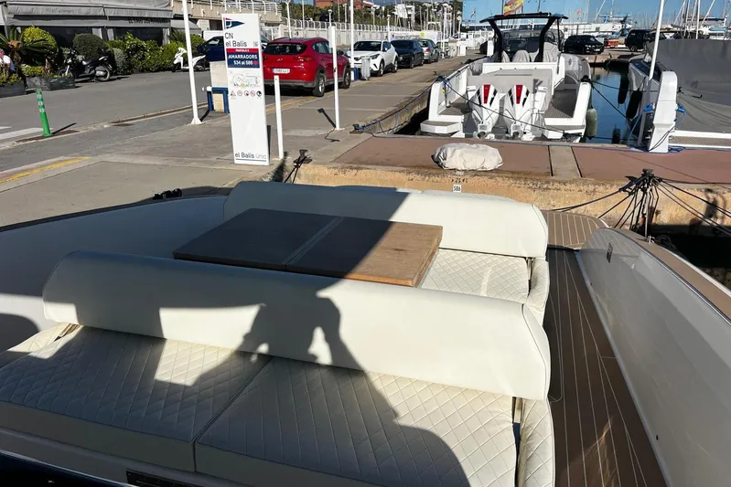 Esimar Yacht Photos Pics 2023 Solaris Power 40 Open yacht docked at marina with seating area.