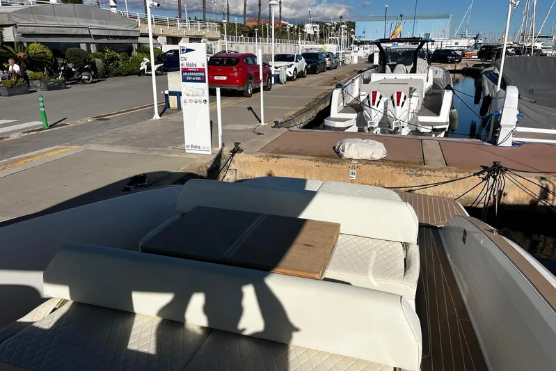 Esimar Yacht Photos Pics 2023 Solaris Power 40 Open yacht docked at marina with seating area.