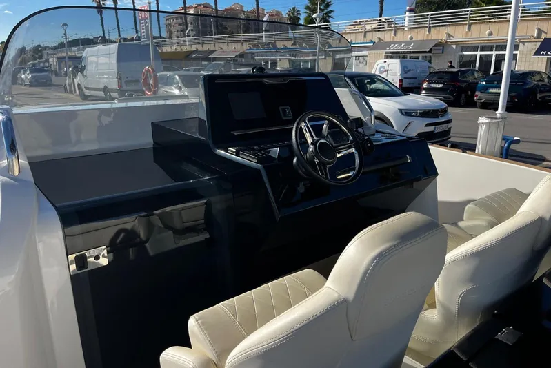 Esimar Yacht Photos Pics 2023 Solaris Power 40 Open boat cockpit with modern steering and dual seats.