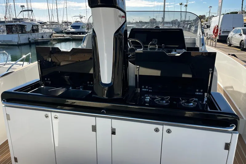 Esimar Yacht Photos Pics 2023 Solaris Power 40 Open yacht kitchen area with stove and sink, docked at marina.