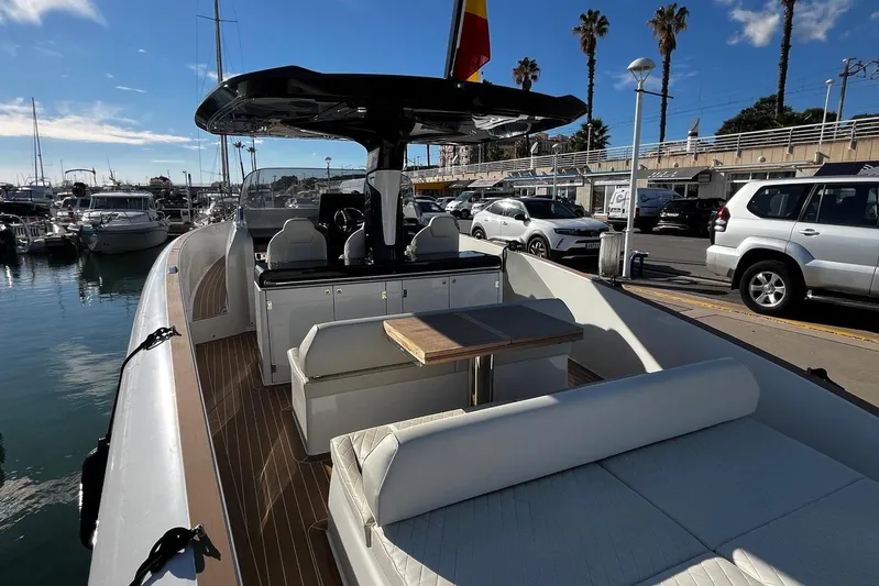 Esimar Yacht Photos Pics 2023 Solaris Power 40 Open yacht docked at marina, featuring sleek design and spacious deck.