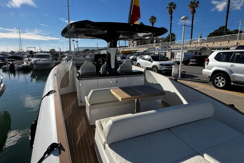 Esimar Yacht Photos Pics 2023 Solaris Power 40 Open yacht docked at marina, featuring sleek design and spacious deck.