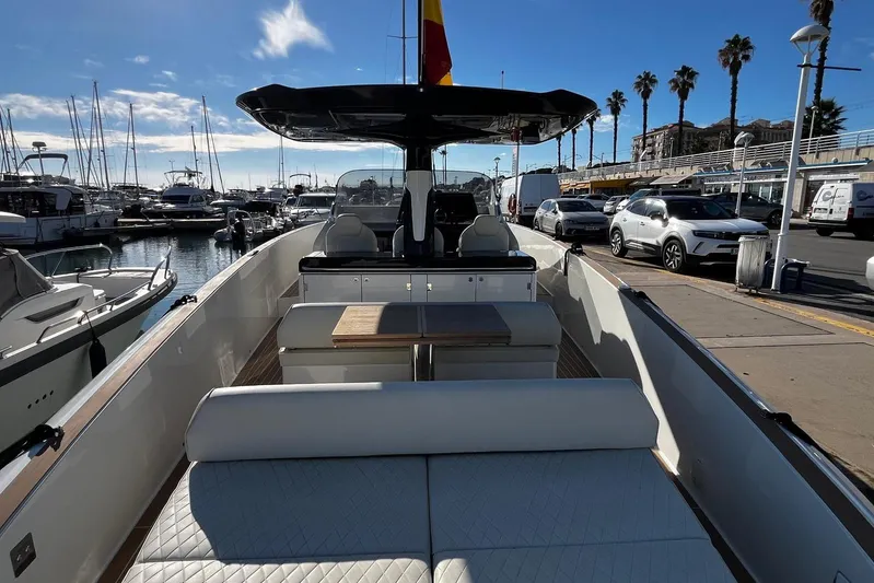 Esimar Yacht Photos Pics 2023 Solaris Power 40 Open yacht docked at a marina under a clear blue sky.