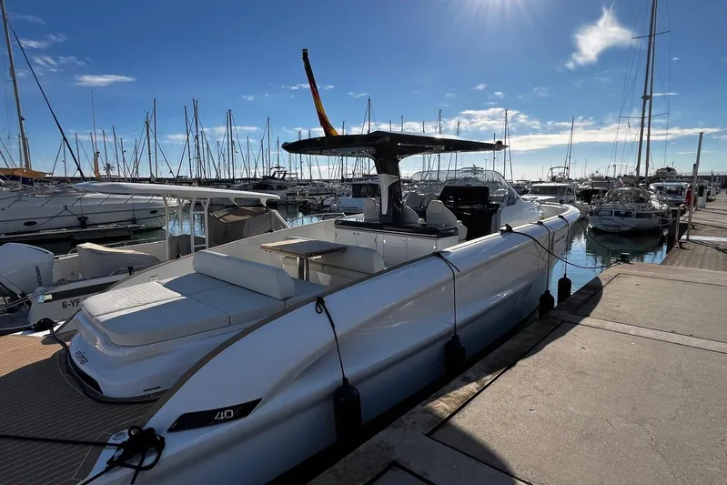 Esimar Yacht Photos Pics 2023 Solaris Power 40 Open yacht docked in a sunny marina, showcasing sleek design.