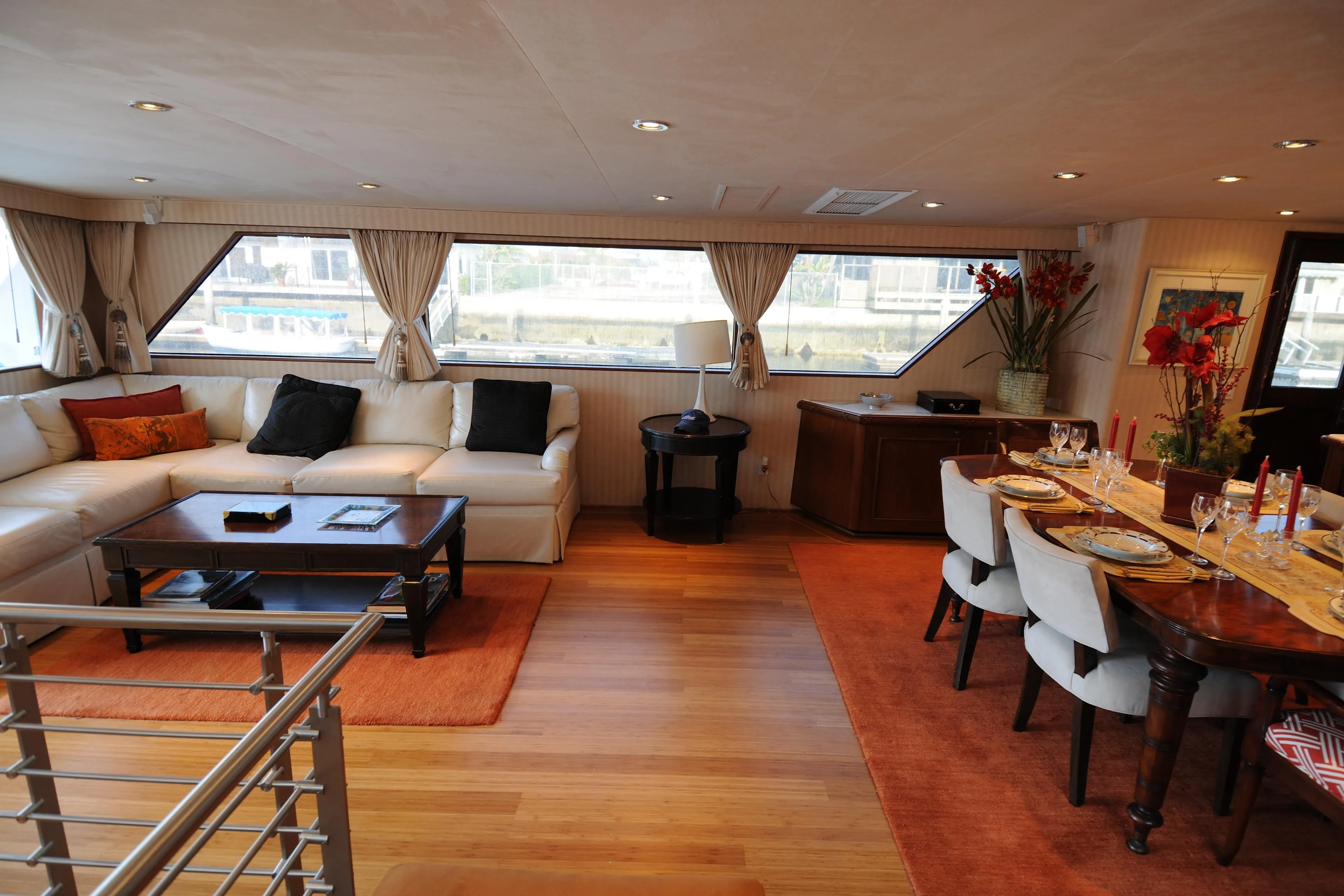 Luxurious interior of 1987 Broward Cockpit Motor Yacht with elegant dining and seating area.