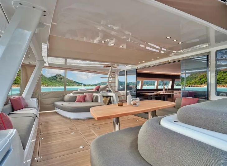 Sicilian Breeze Yacht Photos Pics Luxurious interior of 2021 Lagoon Seventy 7 yacht with scenic ocean view.