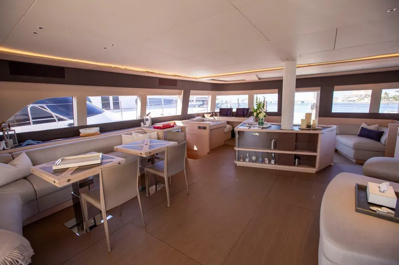 Sicilian Breeze Yacht Photos Pics Luxurious interior of 2021 Lagoon Seventy 7 yacht with modern furnishings and panoramic windows.
