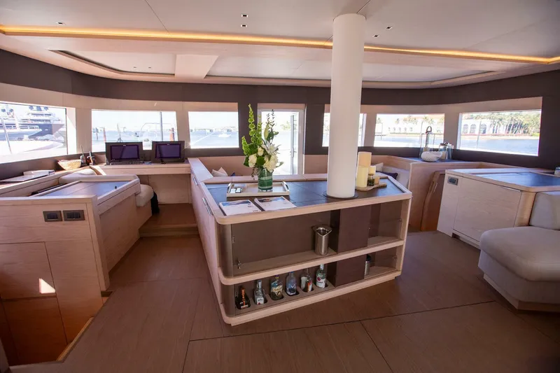 Sicilian Breeze Yacht Photos Pics Luxurious interior of 2021 Lagoon Seventy 7 yacht with modern design and panoramic windows.